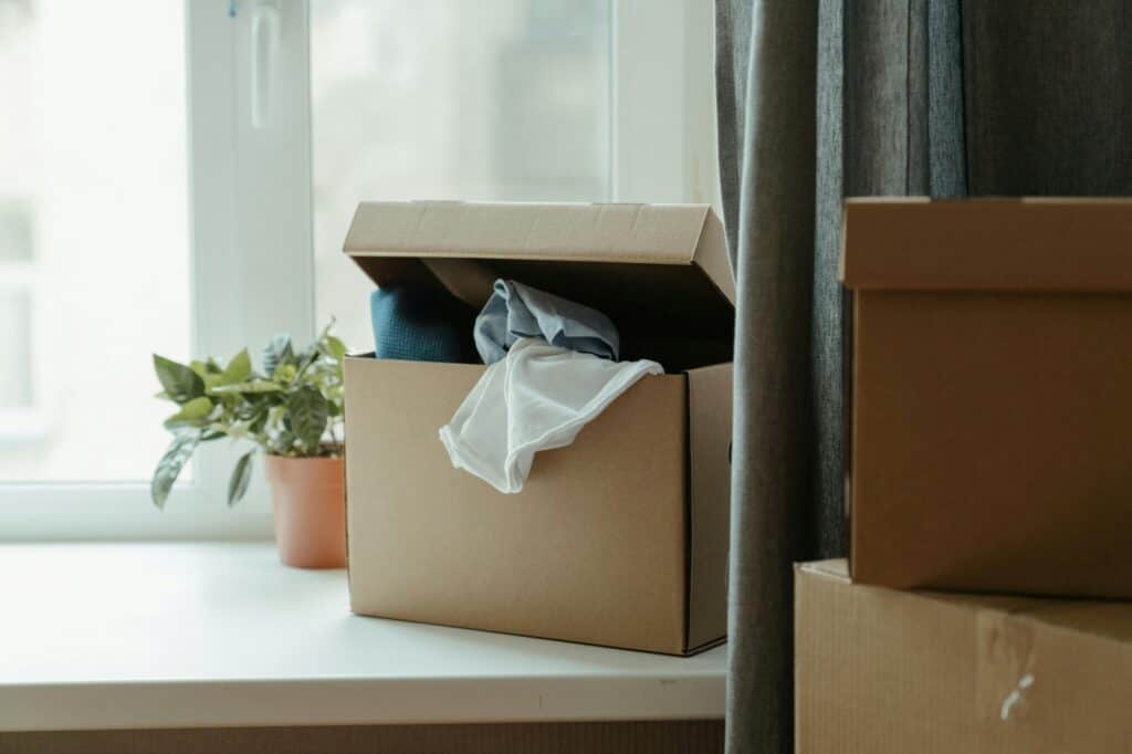 Partially opened carton by the window upon moving into Barnet