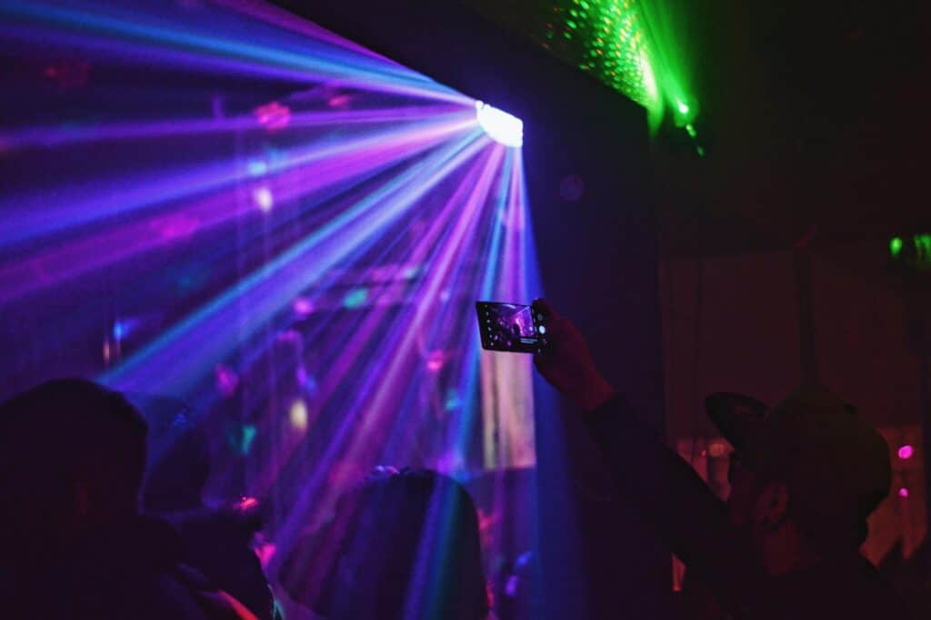 People at the nightclub with neon lights