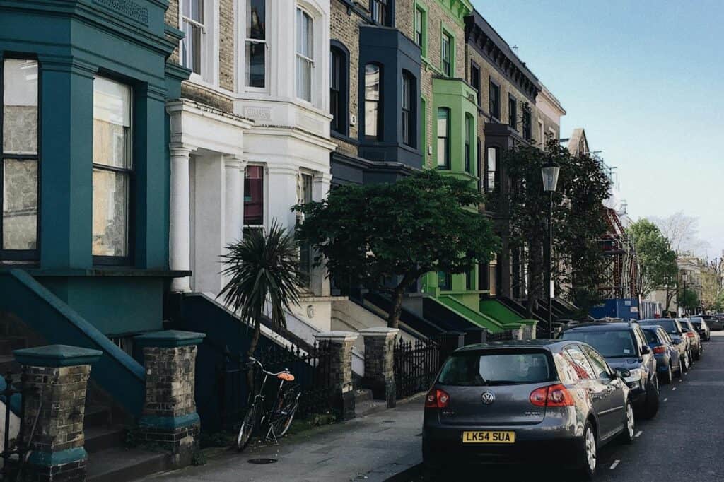 Serial townhouses with moody colours in the concept of 'best affordable housing options in Barnet'.