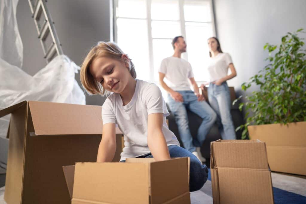 A young family arriving in their new home