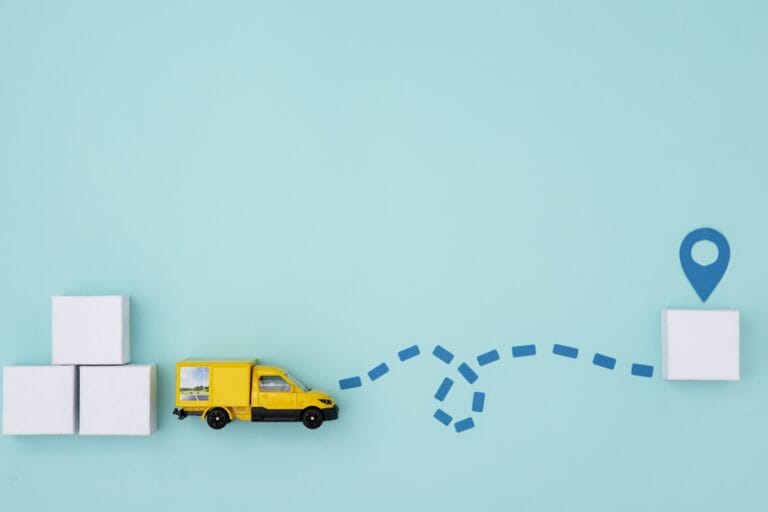 A moving truck toy with moving boxes made of paper toward the direction of the locator pin in the concept of 'Can You Use a Man and Van Service for Long Distance Moves in Barnet'.