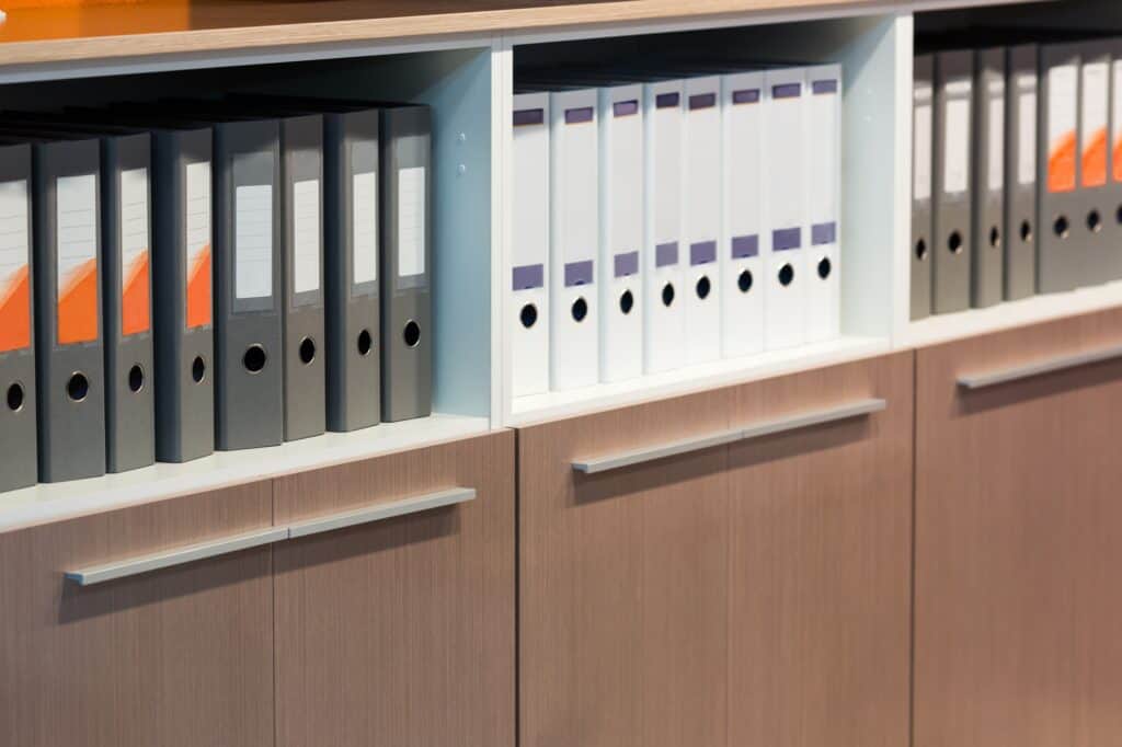 Cropped image of shelves of documents in an office file room